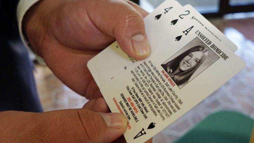 Detective Jim Guzman, from Salt Lake County Sheriff's Office, holds a deck of cards filled with the...